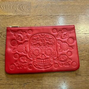 Red Loungefly clutch with sugar skull design